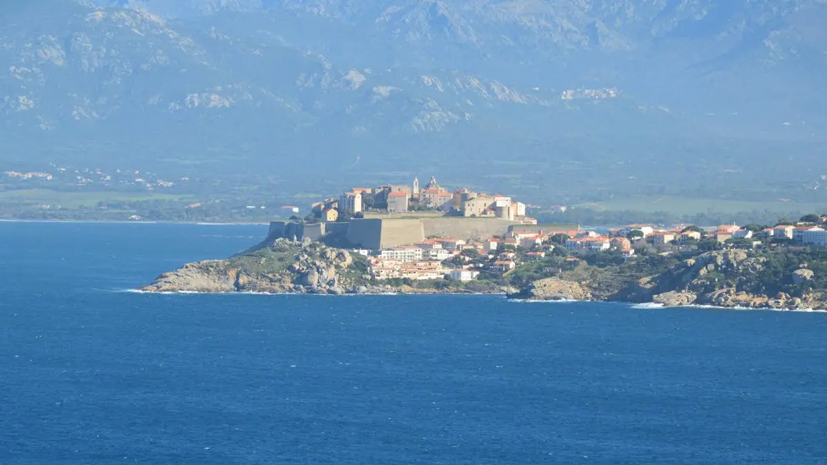 Aerial view of Calvi Citadel on a sunny day in Corsica, France.