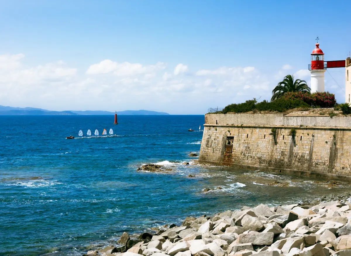 Beautiful seaside view of a lighthouse and rocky coast in Ajaccio, Corsica.