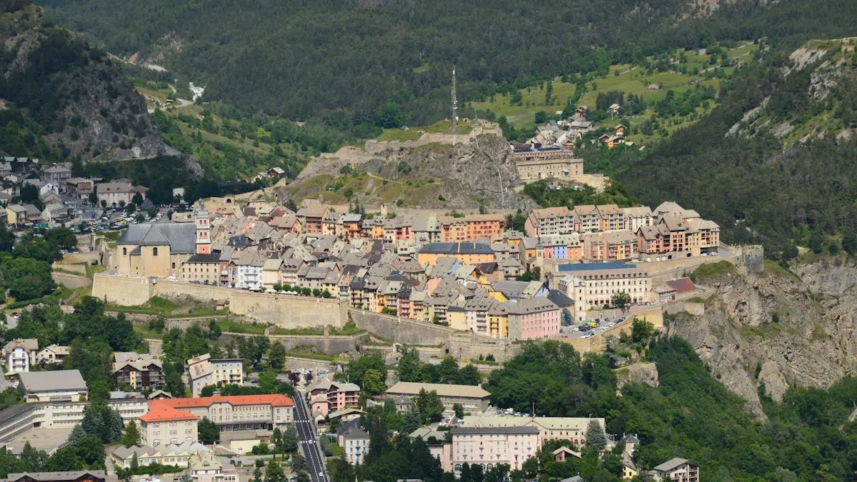 Drone shot of the historic fortified city of Briançon, nestled in the picturesque French Alps.