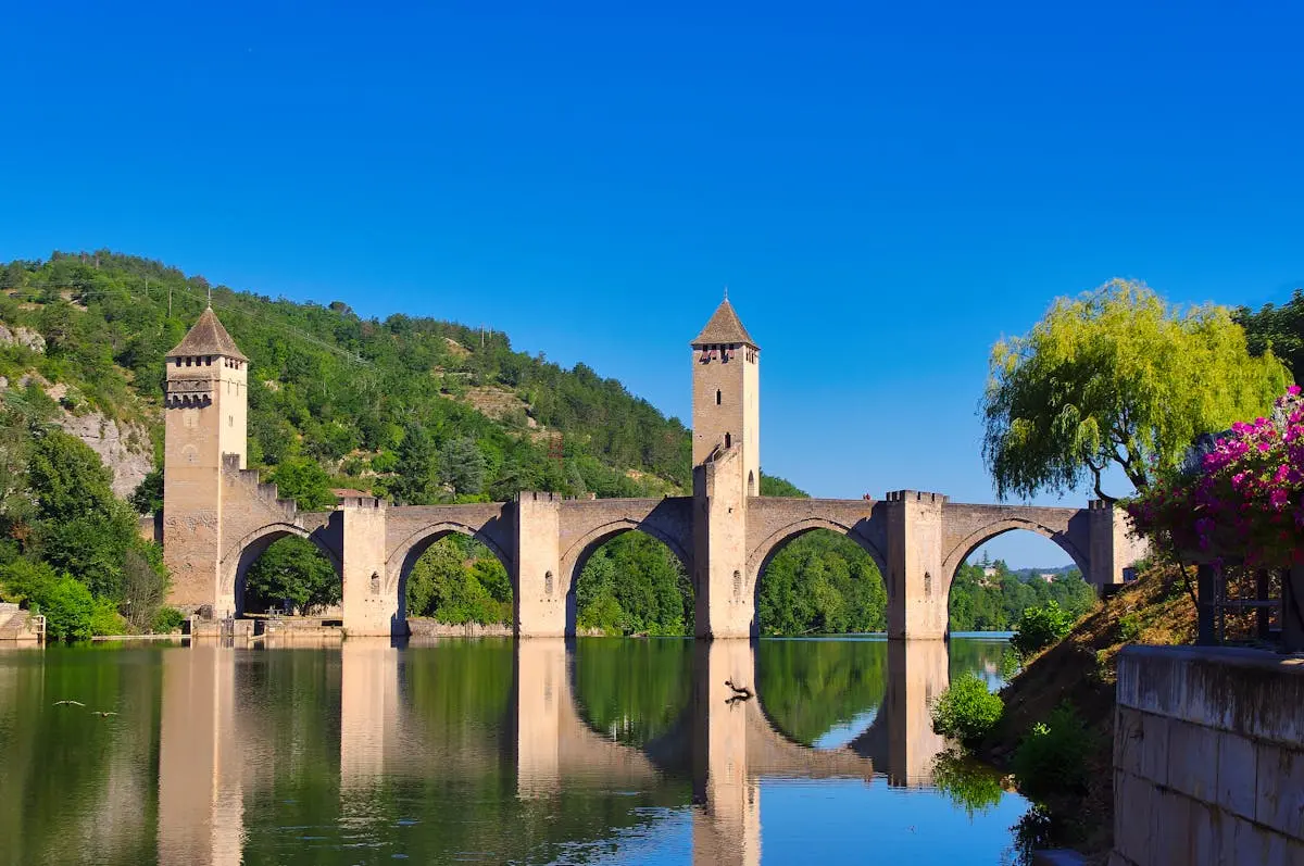 Historic Pont Valentré bridge over Lot River in Cahors, France, a UNESCO World Heritage Site.