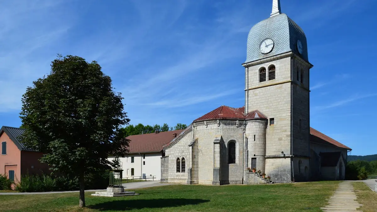 Scenic view of a traditional church tower in Grande-Rivière Château, France.