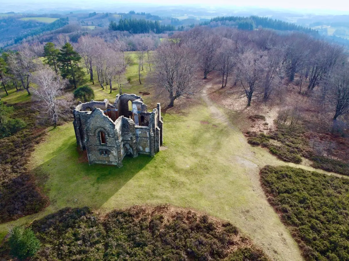 Aerial shot of historical chapel ruins in Mont Gargan, France.