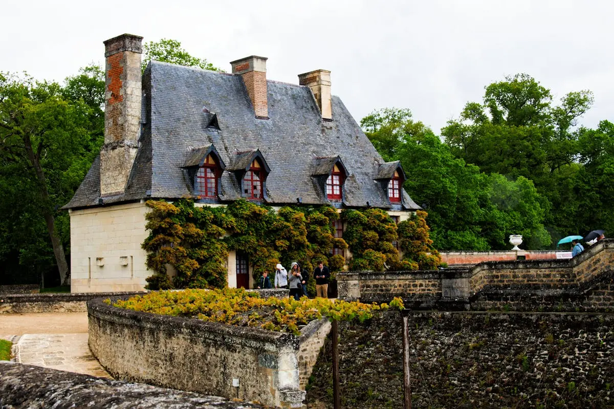 Charming historic manor surrounded by lush greenery in Chenonceaux, France.