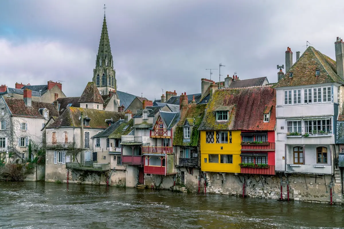 Charming medieval buildings along the Creuse River in Argenton-sur-Creuse, France.