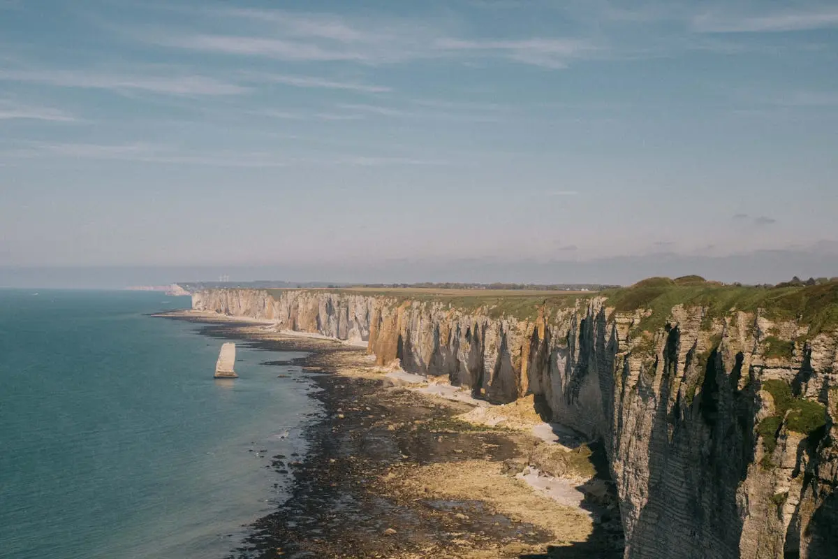 Explore the iconic cliffs of Étretat, showcasing stunning natural beauty along the French coast.