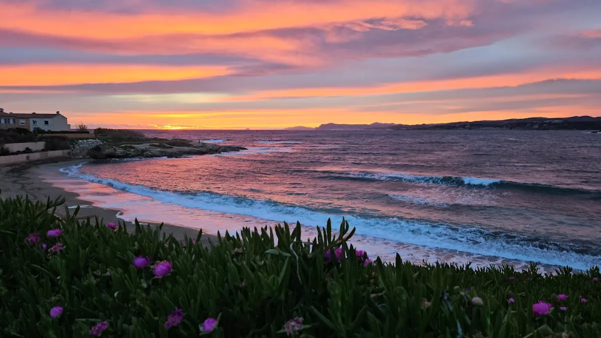 Stunning sunset over a tranquil beach in Six-Fours-les-Plages, capturing vibrant skies and waves.