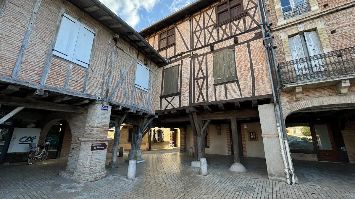 Charming view of medieval timber-framed buildings in a quaint French town.