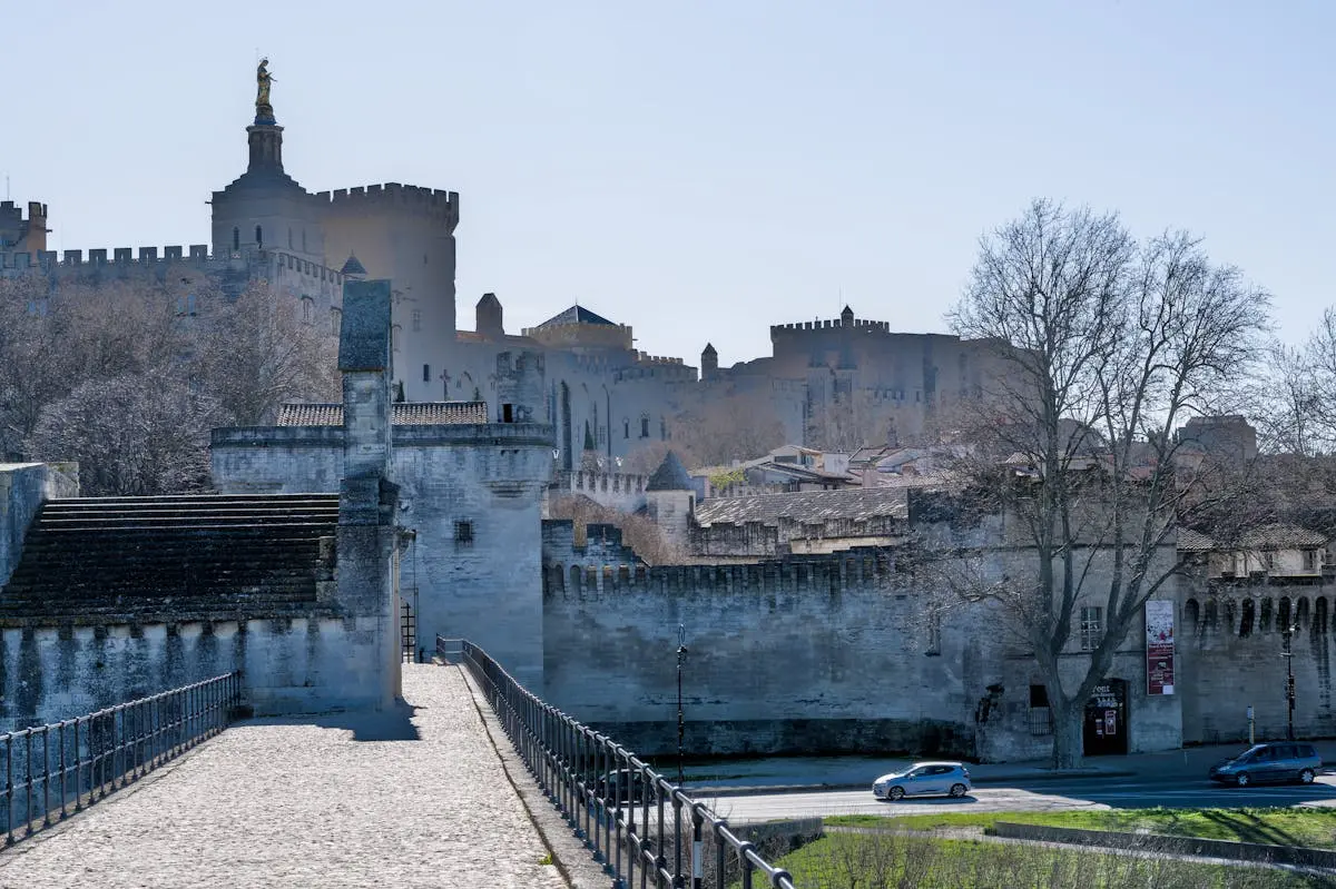 Scenic view of Avignon, France, featuring Pont Saint-Bénézet and Palais des Papes.