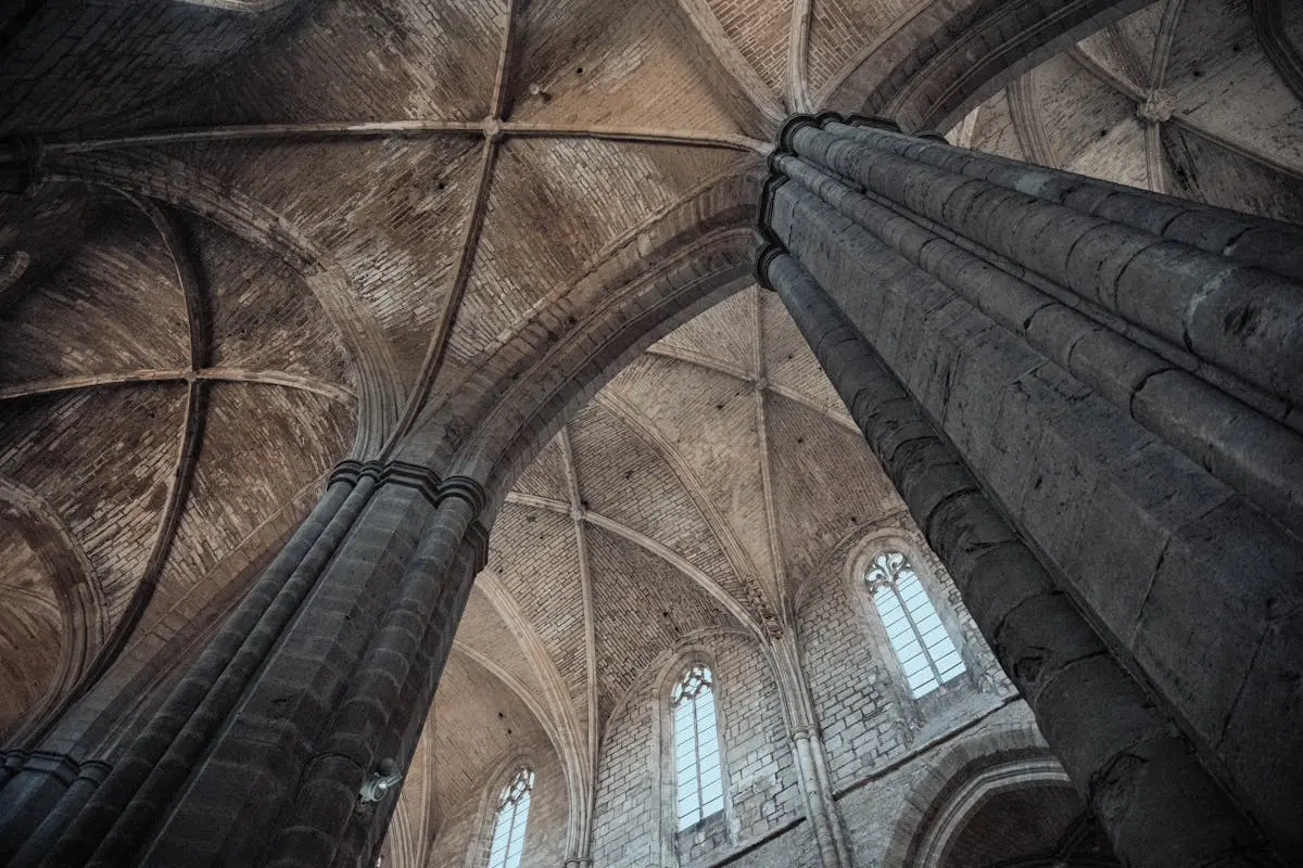 Majestic view of the Gothic arches and dome inside a historic church in Provence, France.