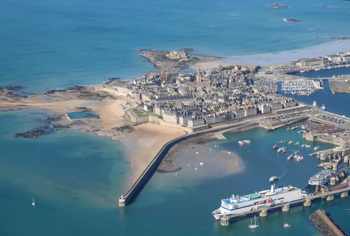 Discover the stunning aerial view of Saint-Malo, France's iconic walled city and bustling coastline.