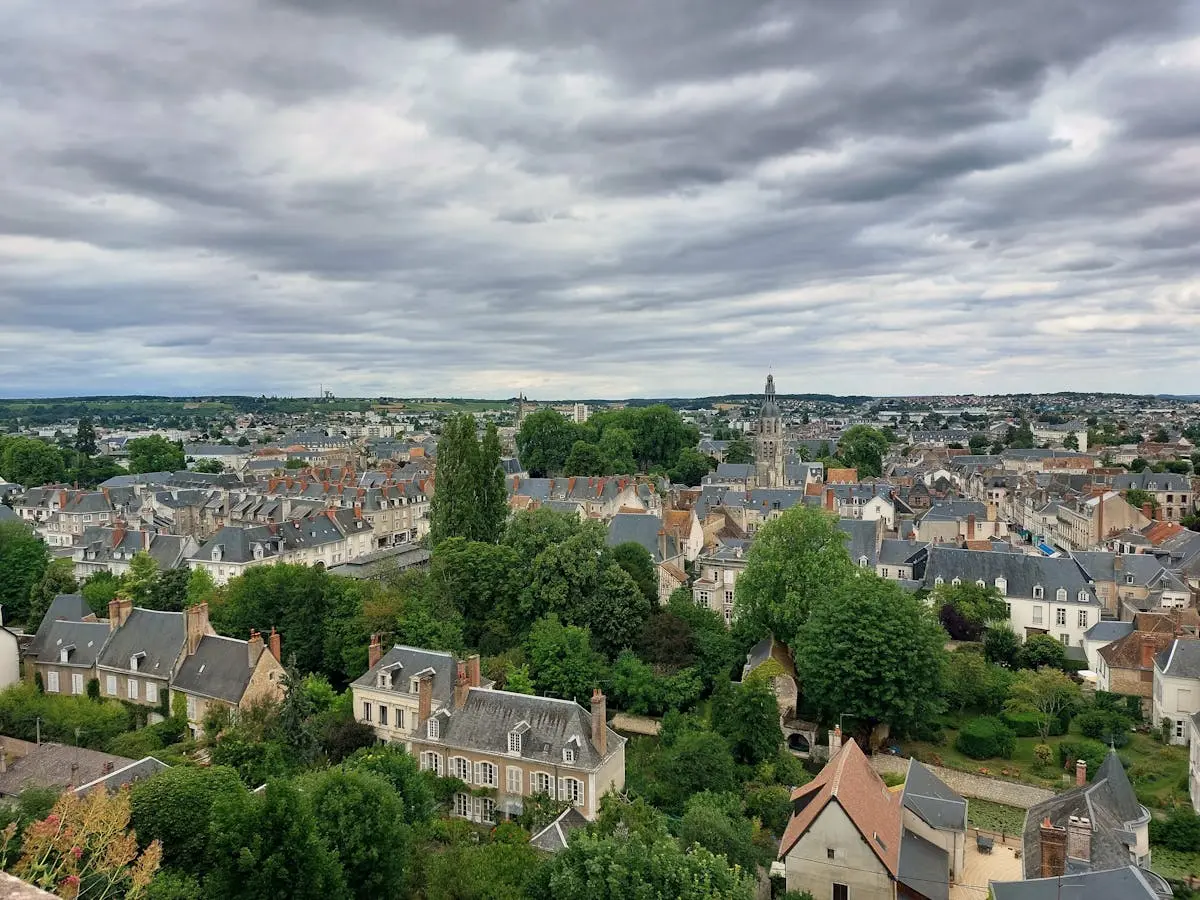 A picturesque aerial view of Vendôme, showcasing historic architecture and lush greenery.